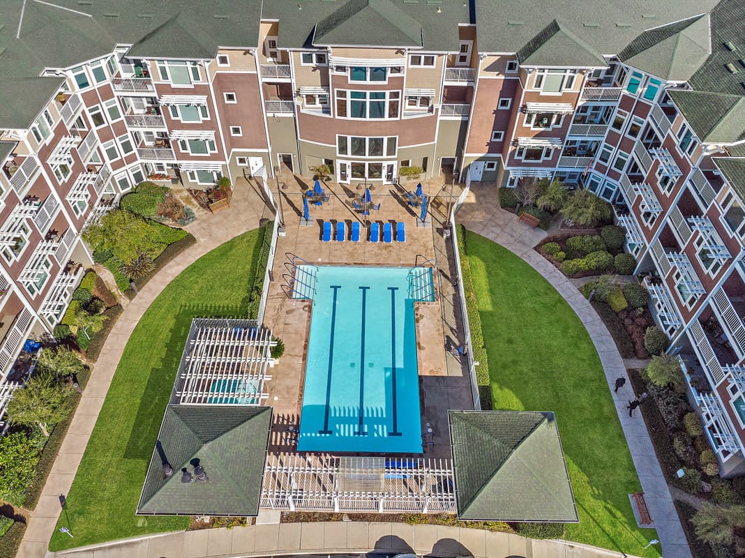 University Retirement Community aerial view of housing and a pool